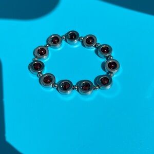 Silver metal and Red garnet color bead stretchy bracelet
